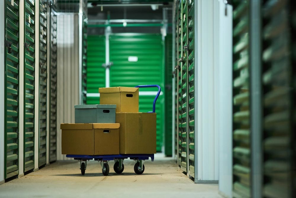 A cart of boxes at a self-storage unit, one of the practical setups for online seller storage solutions.